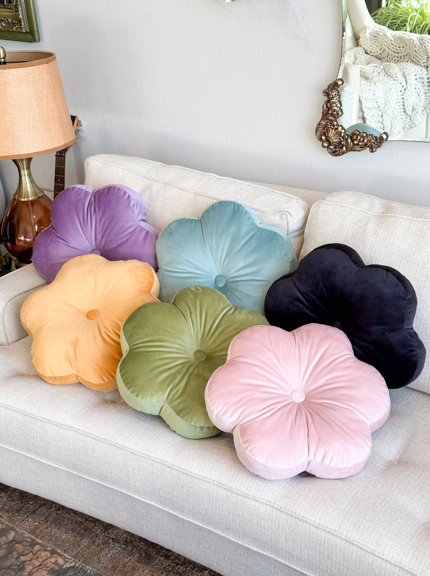 colorful flower pillows on a sofa