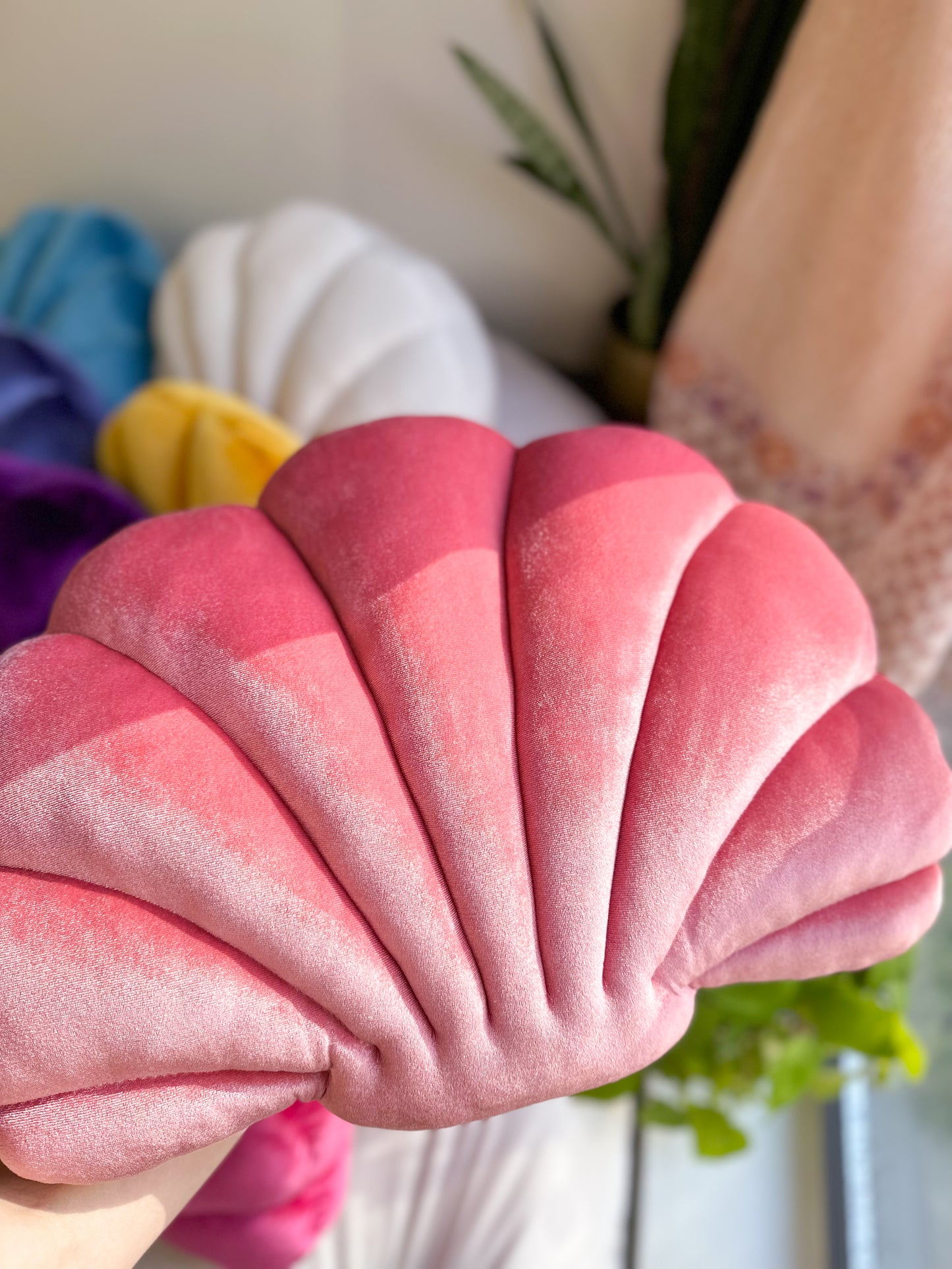 A velvet pink shell pillow